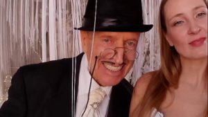 Clothed man and naked women