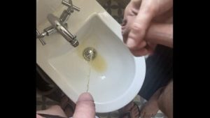 2 amateur boys flatmates (1 ginger, circumcised, with undies and flip flops, 1 naked uncut) pissing together in a bidet