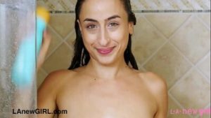 Ellegant brunette model enjoys a sensual shower