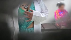 Doctor is giving blowjob to patient while nurse sitting besides?