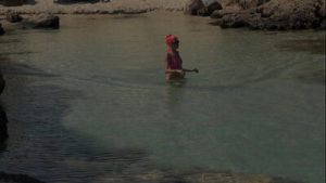 Pink bikini in a beautiful bay