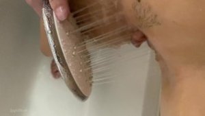 Masturbation with shower head until she had strong shaking orgasm