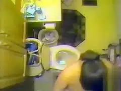 Ceiling cam films her naked in the bathroom