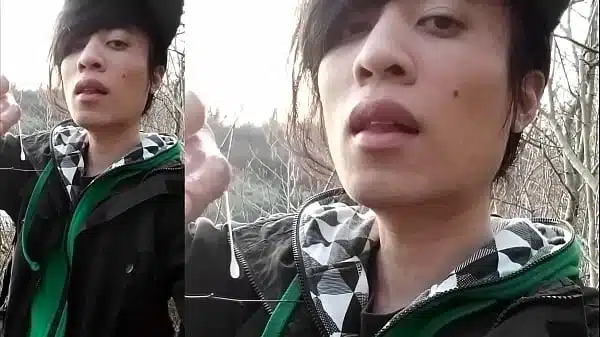 Outdoors, Jon Arteen masturbates his tumescent twink cock, ejaculates cum that sticks to his fingers and slowly drips.