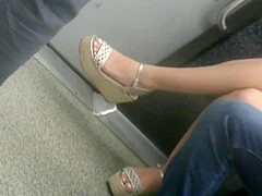 Young brunette, sexy legs in wedges heels