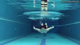 Czech babe Lady Dee takes her shorts off in the pool