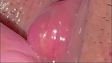 A virgin’s cute pink clitoris.