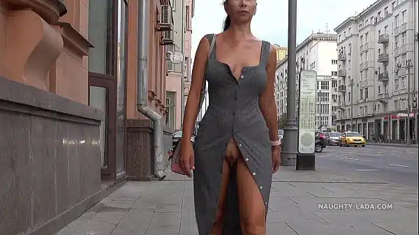 Naughty Lada is walking in public with an open pussy