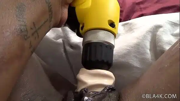 Sexy black stripper Monique has a power tool make her squirt on the bed