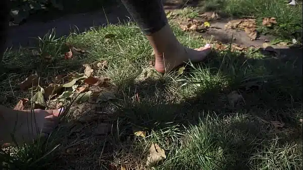 Sexy Feet With Long Toes Crushing Flowers Outdoors